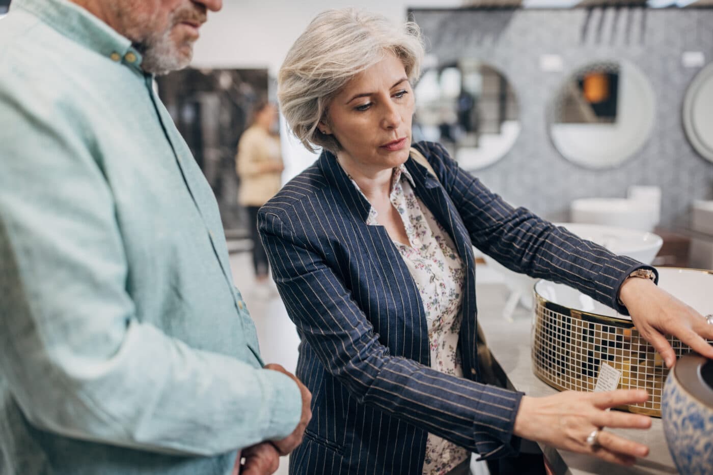 Mature couple shopping for bathroom sink